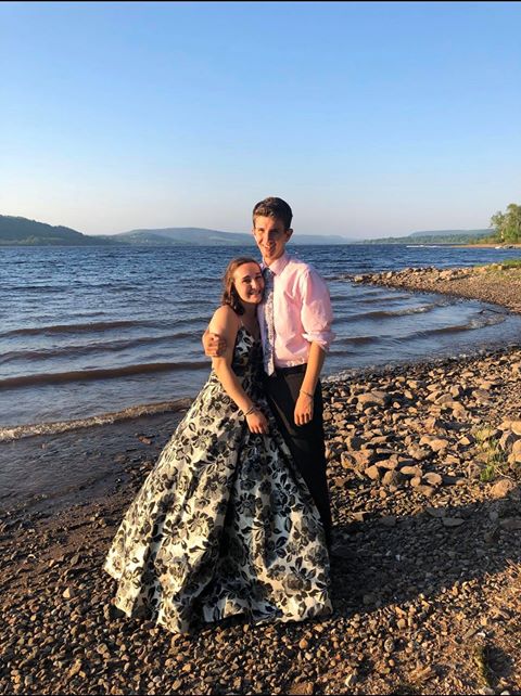 Photo of the prom couple near the lake